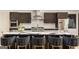 Contemporary kitchen with a marble island and breakfast bar seating at 4217 Paces Ferry Se Rd, Atlanta, GA 30339