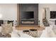 Cozy living room featuring an electric fireplace, sleek TV, and elegant decor at 4217 Paces Ferry Se Rd, Atlanta, GA 30339