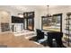 Modern living area featuring statement lighting, dark framed windows, and a pair of stylish chairs at 4217 Paces Ferry Se Rd, Atlanta, GA 30339