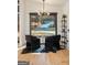 Chic seating area with a modern chandelier and picturesque views from the large window at 4217 Paces Ferry Se Rd, Atlanta, GA 30339