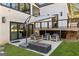 Relaxing patio area with comfortable seating and a modern fire pit, ideal for outdoor entertaining at 4217 Paces Ferry Se Rd, Atlanta, GA 30339
