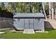 Charming backyard shed offers ample storage space and enhances the property's functionality at 4217 Paces Ferry Se Rd, Atlanta, GA 30339