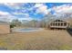 A spacious backyard with a covered pool and a screened-in porch on the house at 240 Sandy Lake Cir, Fayetteville, GA 30214