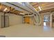 Spacious basement with an open layout featuring utilities and easy access to the rest of the house at 240 Sandy Lake Cir, Fayetteville, GA 30214