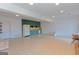 Large finished basement featuring tile floors, a wet bar and a white refrigerator at 240 Sandy Lake Cir, Fayetteville, GA 30214