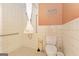 Bathroom includes a walk-in tiled shower with a safety grab bar and a standard white toilet at 240 Sandy Lake Cir, Fayetteville, GA 30214