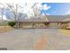 Carport area with stone pillars and basketball hoop at 240 Sandy Lake Cir, Fayetteville, GA 30214