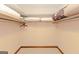Walk-in closet features neutral colored walls, carpet and shelves for optimal storage solutions at 240 Sandy Lake Cir, Fayetteville, GA 30214
