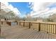 Exterior deck with a view of the property and a partially covered pool at 240 Sandy Lake Cir, Fayetteville, GA 30214