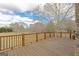 Wide wooden deck overlooking a spacious yard with mature trees, perfect for outdoor entertaining or relaxation at 240 Sandy Lake Cir, Fayetteville, GA 30214