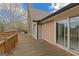 Exterior deck with a view of the stone chimney, siding, windows and gutters of the house at 240 Sandy Lake Cir, Fayetteville, GA 30214