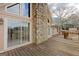 Exterior view of a stone chimney and wooden deck area at 240 Sandy Lake Cir, Fayetteville, GA 30214