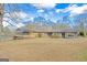 Backyard view of home showing screened porch and pool at 240 Sandy Lake Cir, Fayetteville, GA 30214