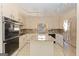 Bright kitchen with stainless steel appliances, granite countertops, ample cabinet space, and center island at 240 Sandy Lake Cir, Fayetteville, GA 30214