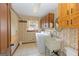 Functional laundry room features cabinetry, sink, and washer/dryer hookups at 240 Sandy Lake Cir, Fayetteville, GA 30214