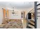 Cozy living space featuring a spiral staircase, chandelier, and an open layout perfect for entertaining at 240 Sandy Lake Cir, Fayetteville, GA 30214