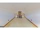 Upstairs loft with neutral carpet featuring a rail overlooking the living room with high ceilings at 240 Sandy Lake Cir, Fayetteville, GA 30214