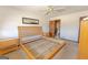 Vacant main bedroom features a wooden bed frame with a walk-in bathroom at 240 Sandy Lake Cir, Fayetteville, GA 30214