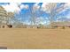 The backyard contains multiple outbuildings at 240 Sandy Lake Cir, Fayetteville, GA 30214