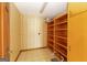 Walk-in pantry with open shelving and tile flooring offers ample storage at 240 Sandy Lake Cir, Fayetteville, GA 30214