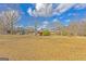 Spacious yard with mature trees and lush greenery, offering privacy and scenic views at 240 Sandy Lake Cir, Fayetteville, GA 30214