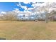The home and a storage shed on a large, grassy lawn at 240 Sandy Lake Cir, Fayetteville, GA 30214