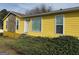 Charming yellow home with stone accents and landscaped front yard for curb appeal at 3796 Saddle Ridge Dr, Snellville, GA 30039