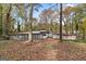 A spacious backyard with a screened-in porch, perfect for enjoying the beauty of fall at 2544 Overlook Dr, East Point, GA 30344