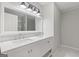 Bright bathroom with double sink vanity and large mirror and light fixture above at 2544 Overlook Dr, East Point, GA 30344