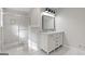 Spacious bathroom with double sink vanity, walk-in shower, and modern fixtures at 2544 Overlook Dr, East Point, GA 30344