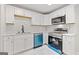 Beautiful modern kitchen with white cabinets, stainless steel appliances at 2544 Overlook Dr, East Point, GA 30344