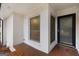 Inviting front porch with white brick and a black framed glass door at 2544 Overlook Dr, East Point, GA 30344