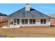 Back exterior with a patio, backyard, and neutral siding at 509 Carleton Pl, Locust Grove, GA 30248