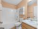 Cozy bathroom features a tub with shower, white vanity, and a built-in medicine cabinet at 509 Carleton Pl, Locust Grove, GA 30248