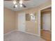 Comfortable bedroom featuring neutral carpet and walls, two entryways and a ceiling fan at 509 Carleton Pl, Locust Grove, GA 30248