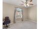 Comfortable bedroom featuring neutral carpet and walls, a ceiling fan and a lovely window at 509 Carleton Pl, Locust Grove, GA 30248