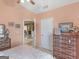 Charming bedroom with vaulted ceiling and a view into the home's living room space at 509 Carleton Pl, Locust Grove, GA 30248