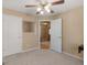 Comfortable bedroom featuring neutral carpet and walls, two entryways and a sewing machine at 509 Carleton Pl, Locust Grove, GA 30248