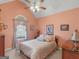 Comfortable bedroom with vaulted ceilings, soft lighting, and decorative window treatments at 509 Carleton Pl, Locust Grove, GA 30248