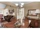 Lovely dining room features chandelier, wood dining set, and entry into the living room at 509 Carleton Pl, Locust Grove, GA 30248