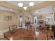 Open-concept dining area with hardwood floors and views of the living room fireplace at 509 Carleton Pl, Locust Grove, GA 30248