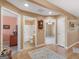 Hallway showcasing hardwood floors, recessed lighting, and doors leading to other rooms at 509 Carleton Pl, Locust Grove, GA 30248