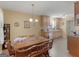 Bright kitchen and dining area featuring light wood cabinets and wooden dining table at 509 Carleton Pl, Locust Grove, GA 30248