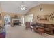 Spacious living room with a fireplace, comfortable seating, and seamless flow into dining area at 509 Carleton Pl, Locust Grove, GA 30248