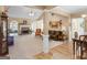 Spacious living room with fireplace, ceiling fan, plush carpet, and comfortable seating at 509 Carleton Pl, Locust Grove, GA 30248