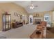 Inviting living room featuring a fireplace, vaulted ceilings, and large windows for natural light at 509 Carleton Pl, Locust Grove, GA 30248