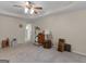 Expansive bedroom with ceiling fan, tray ceiling, and lots of open floor space at 509 Carleton Pl, Locust Grove, GA 30248