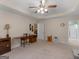 Large, carpeted main bedroom featuring a tray ceiling, neutral paint, and lots of natural light at 509 Carleton Pl, Locust Grove, GA 30248