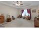Neutral main bedroom with tray ceilings with view of other bedroom furnishings at 509 Carleton Pl, Locust Grove, GA 30248