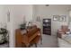 Home area displaying upright piano with built-in bookcase and decor at 509 Carleton Pl, Locust Grove, GA 30248